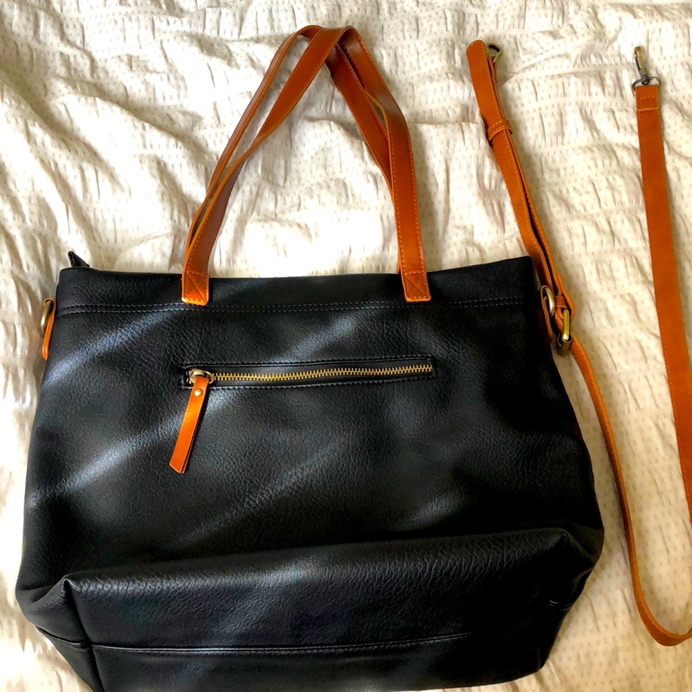 Black Tote bag with shoulder and crossbody strap.